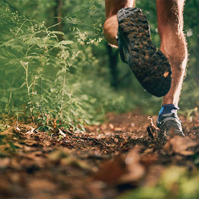 A man running on a trail.